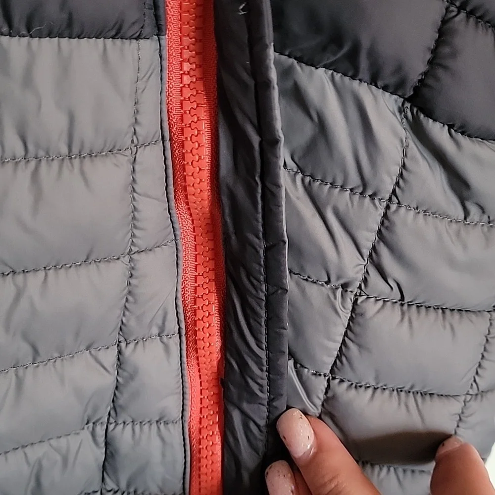 Snozu infant snowsuit, 3-6 months. Different shades of gray with orange lining.